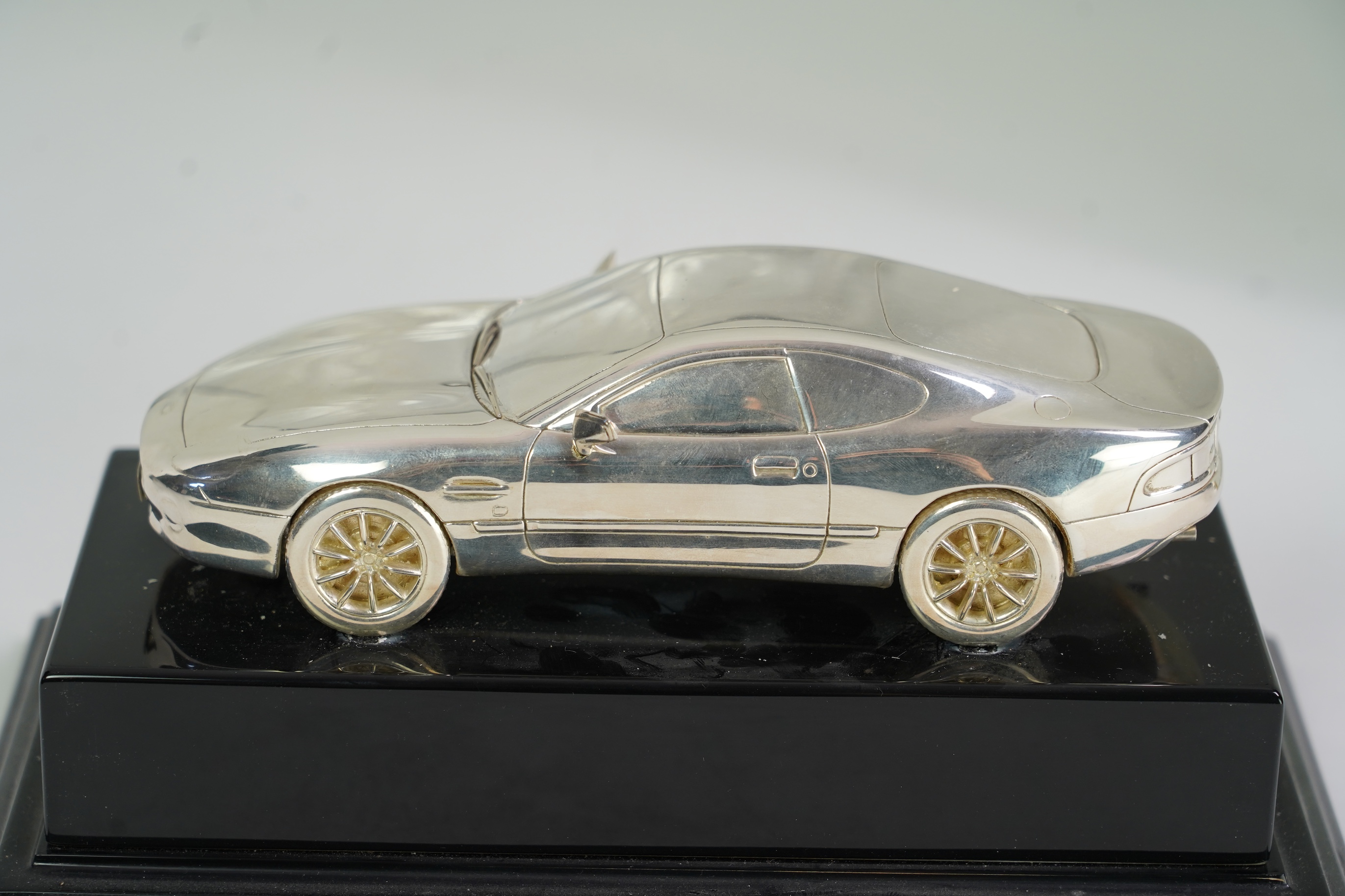 An Elizabeth II miniature silver model of an Aston Martin DB7 Vantage, by Aston Martin Lagonda Design Ltd